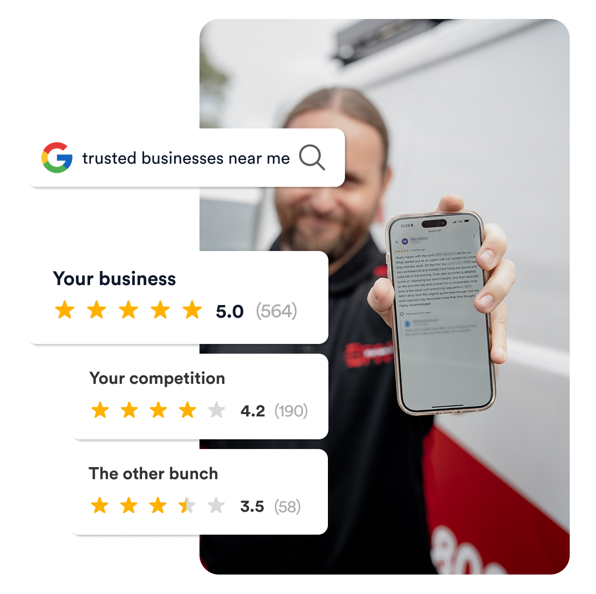 Man holding his phone to the screen that has a great review on it